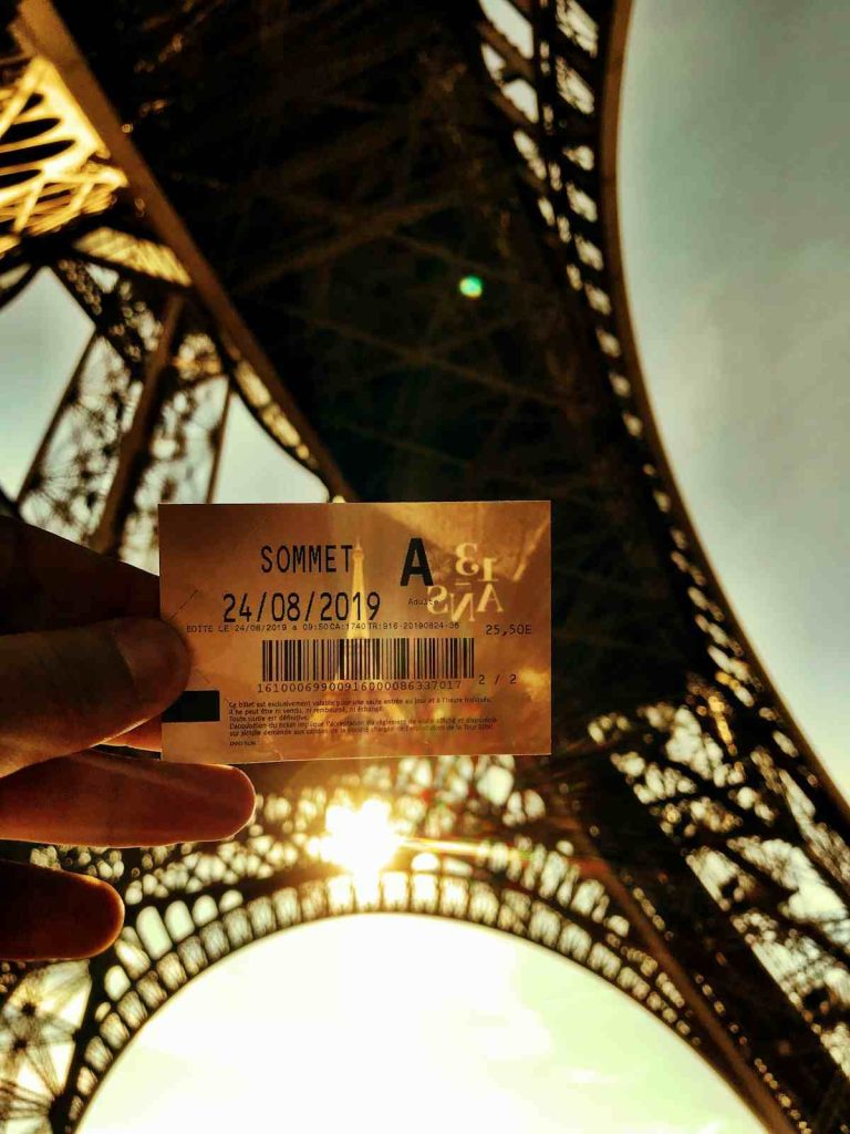 person holding gold and black card